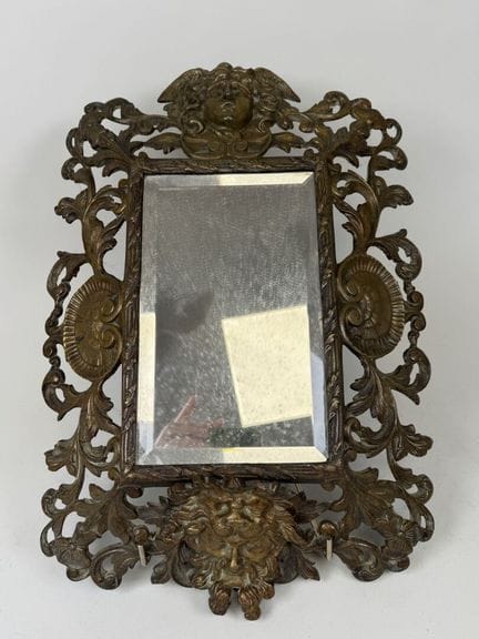 Rectangular mirror in openwork bronze with a patin
