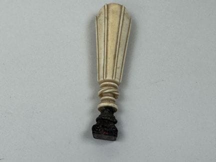 A seal made of synthetic ivory; the die is likely 