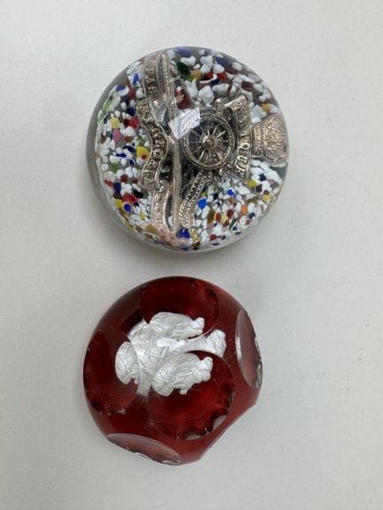 Two glass paperweight spheres, one decorated with 