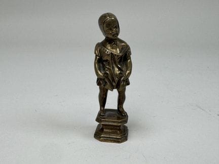 Probably a seal or small gilded bronze figurine de