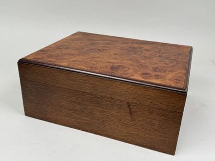 Wooden cigar humidor with a burl finish and gold-p
