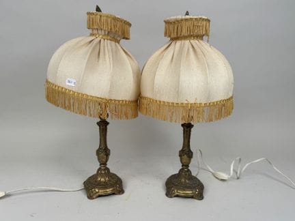 Pair of gold-colored metal lamps with fringed fabr