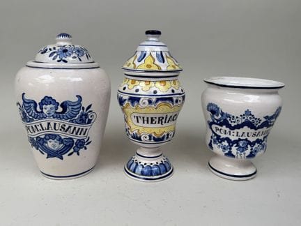 Two medicine jars and one lidded jar made of polyc
