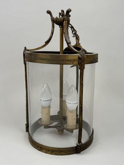 Three-light brass and glass cage pendant light.
H.
