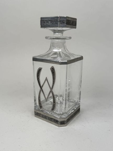Molded and pressed glass carafe with a pewter base