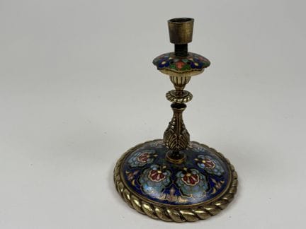 Small, single-flower bronze candlestick in the clo