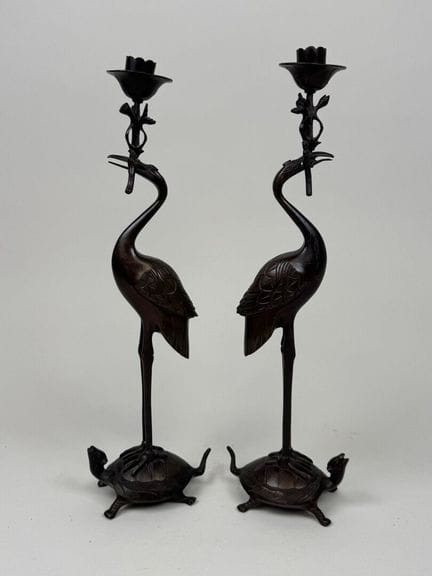 ASIA, 20th century.
Pair of patinated bronze candl