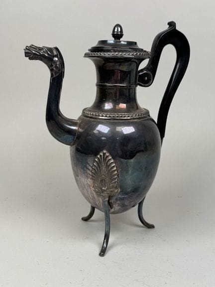 Silver plated metal tripod pitcher with a zoomorph