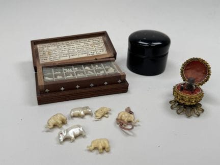 A small doll's sewing kit made of chiseled and ope