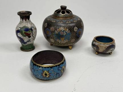 A set of cloisonné bronze or brass pieces decorate