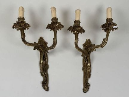 Pair of chiseled bronze or brass wall sconces with