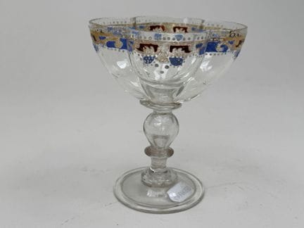Small blown-glass goblet on a stem, with a multi-l