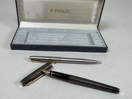 PARKER.
Foreign silver fountain pen, 14k gold nib.