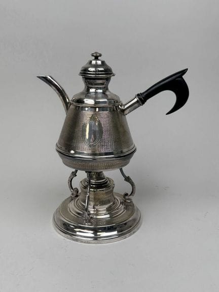 Small silver plated metal alcohol stove with a gui