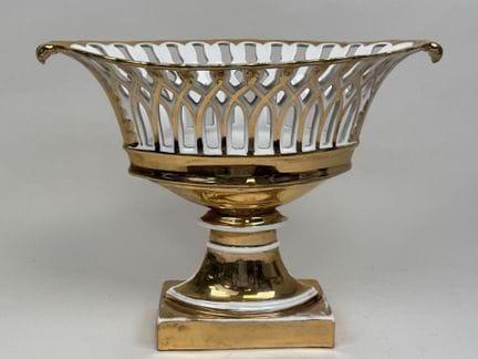 Large openwork bowl made of white and gold porcela