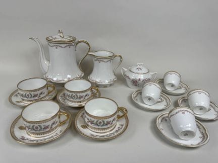 A polychrome and gold porcelain tea and coffee set