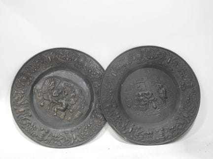 Cast-iron mantelpiece plate with blacksmith motifs
