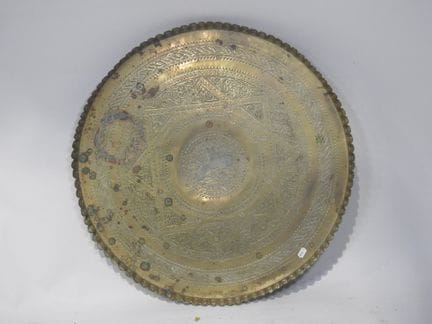 Pair of circular brass wall plates with repoussé d
