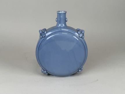 ASIA, 20th century Earthenware flask on a blue bac