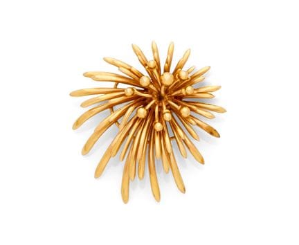 18K yellow gold (750‰) brooch decorated with plant