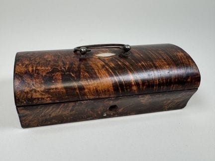 A small rectangular box made of wood and veneer, w