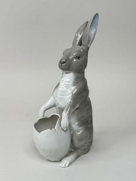 A polychrome porcelain figurine depicting a rabbit
