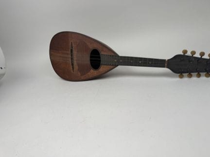 Wood and metal mandoline.
Has an "OZELLI" label on