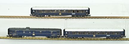Three CIWL Ho-scale cars, Chinese-made on a Rivaro