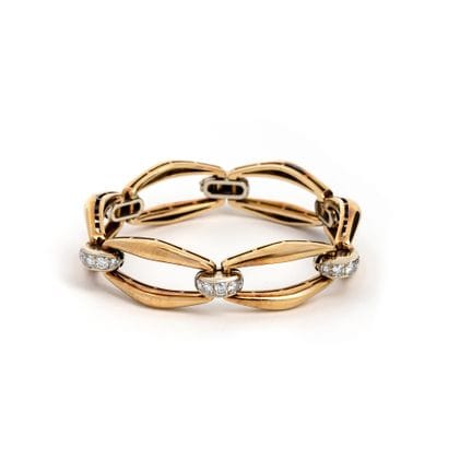 Armband mit Diamanten.
18-karätiges Zweifarbgold (
