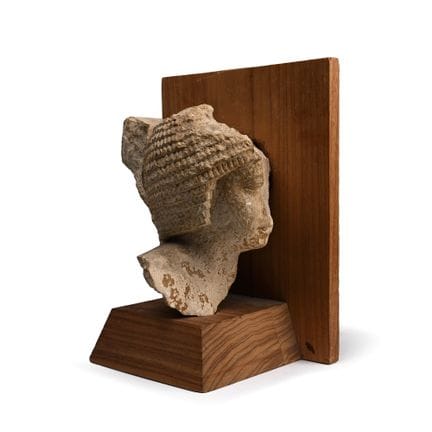 Egyptian Limestone Head of a Noble Wearing a Curle