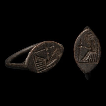 Large Greek Bronze Ring with Seated Figure. Circa 