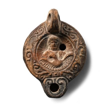 Lampada a olio romana in terracotta in miniatura c
