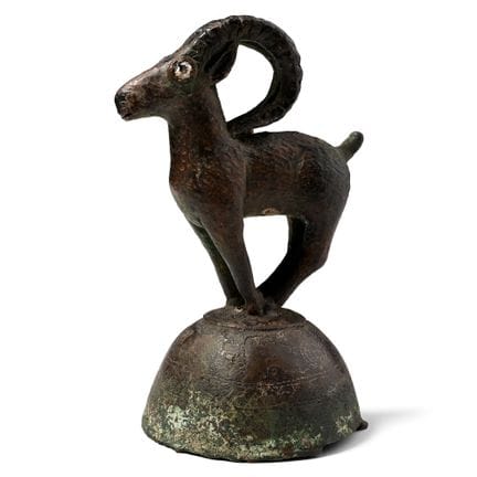 Khorasan Bronze Stand with Ibex. Circa 11th-12th c