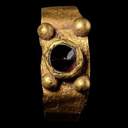 Roman Gold Ring with Conical Ruby-Coloured Gem. 2n