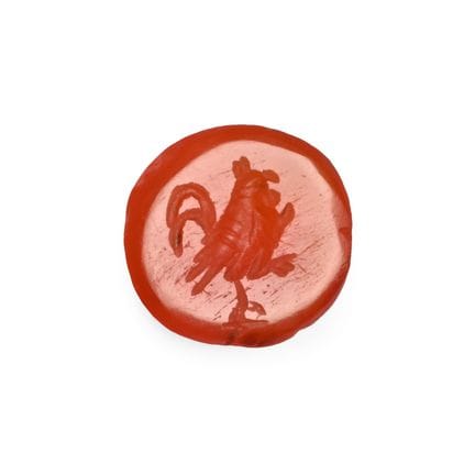 Gemme romaine en cornaline représentant un coq. Ie