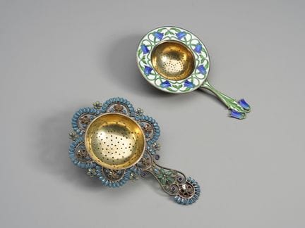 19TH-20TH CENTURY SILVERWARE Two strainers in embo