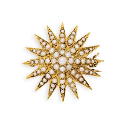 BROCHE/PENDENTIF EN OR EN FORME D'ÉTOILE ORNÉE DE 