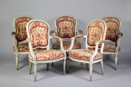 A set of five cabriolet armchairs with wavy-backed