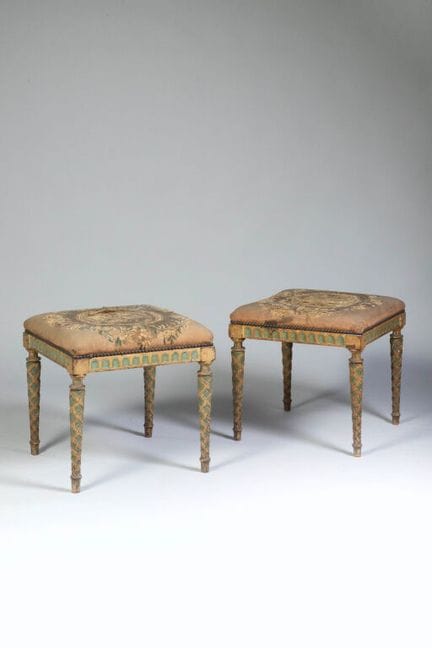Pair of wooden stools with a cream and green lacqu