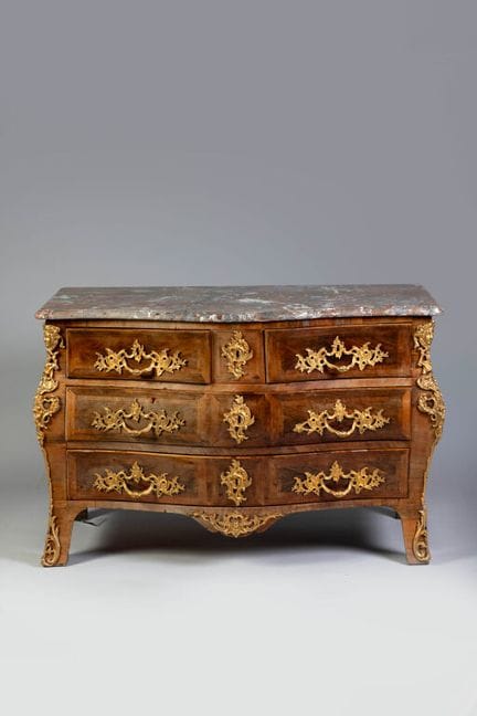 A tomb-style chest made of wood veneer arranged in