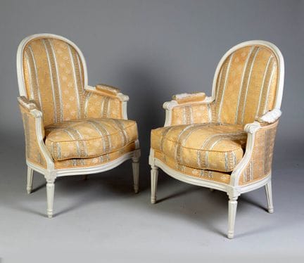 Pair of wingback chairs with curved backs, made of