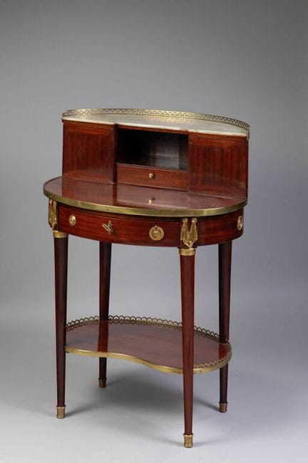 Oval “Bonheur-du-jour” desk made of mahogany venee