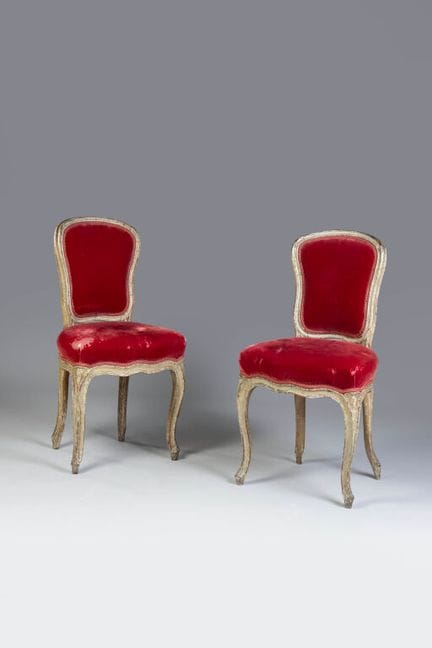 A set of two cabriolet-style chairs with violin-ba