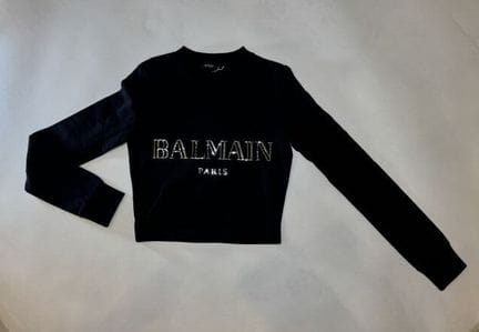 BALMAIN, Paris.
Sweet en coton noir avec griffe XX