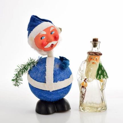 Sculpted glass bottle with a stopper shaped like S