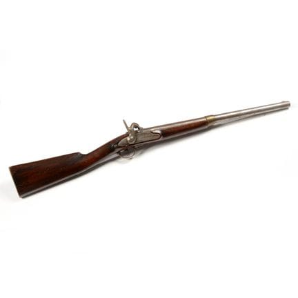 Muzzle-loader, carved walnut stock with iron fitti