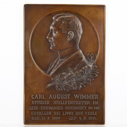 Bronze, rectangular with a recessed portrait tondo