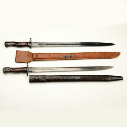Each with a blade featuring a fuller, a wooden han