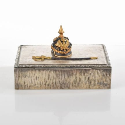 Silver-plated case with a fine relief pattern; the