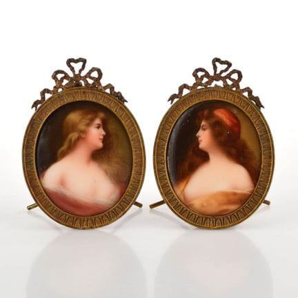 Oval porcelain plaques, slightly domed, each featu